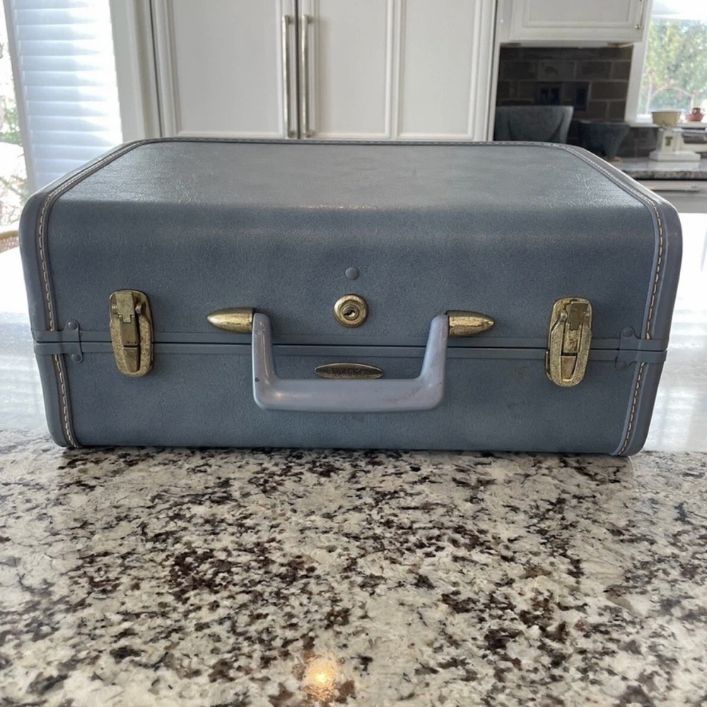Vintage Blue Suitcase with Gold Accents